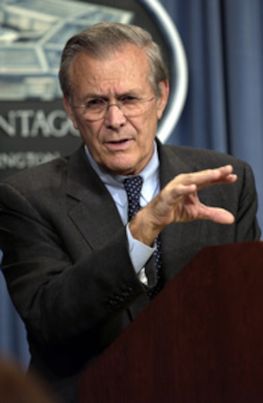 Secretary of Defense Donald H. Rumsfeld gestures as he responds to a reporter's question during a Pentagon press briefing on Sept. 16, 2003. 