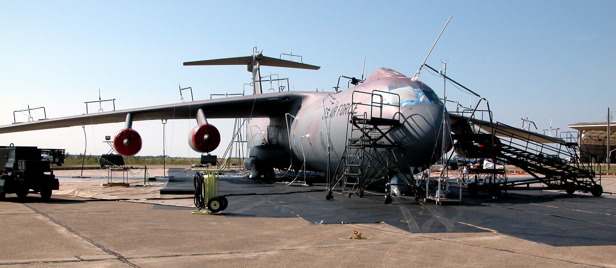EGLIN AIR FORCE BASE, Fla. -- A C-141 Starlifter is covered with suction-powered collection funnels to measure the amount of contamination it has received from a simulated chemical attack.  The Starlifter is from the 305th Airlift Squadron at McGuire Air Force Base, N.J.  (U.S. Air Force photo by Tara Cheek)