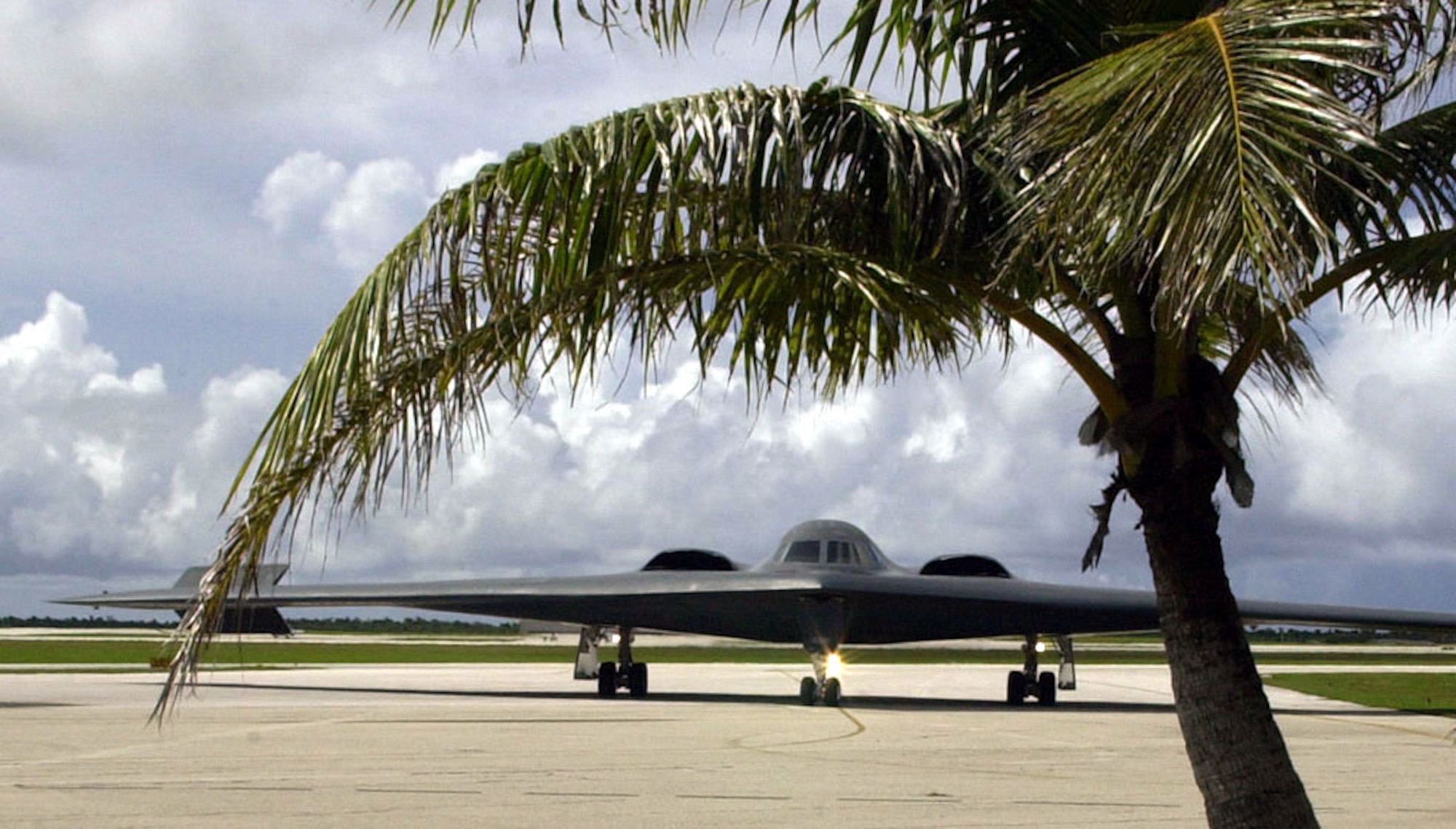 A B-2 Spirit taxis into place on the flightline at Andersen Air Force Base,Guam Sept. 17 after an 18-hour flight from its home at Whiteman AFB, Mo.  Two B-2s and about 100 Airmen from the 509th Bomb Wing are at Andersen AFB for a bomber training exercise.  Andersen is a forward-operating location for bombers and is a key player in the Air Force's global power projection.  (U.S. Air Force photo/Airman 1st Class Joshua Strang)