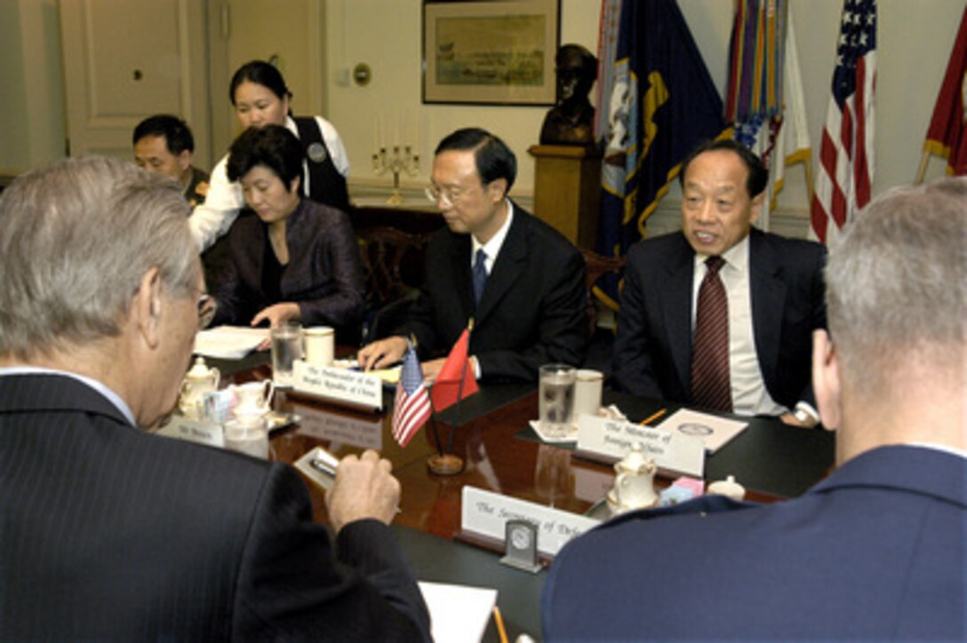 Peoples Republic of China Foreign Minister Li Zhaoxing (right, far side of table), meets with Secretary of Defense Donald H. Rumsfeld (left foreground) in the Pentagon to discuss a broad range of bilateral security issues on Sept. 23, 2003. Also participating in the talks, on the Chinese side, are Ambassador to the U.S. Yang Jiechi (center), Chinese Spokeswoman Shang Qiyue (2nd from left) and Col. Xu Jing Zhi (far left), the military attaché' at the Chinese Embassy in Washington, D. C. Seated to the right of Rumsfeld is Air Force Gen. Richard B. Myers, chairman of the Joint Chiefs of Staff. 