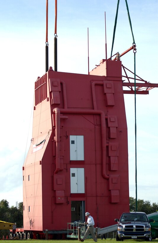 CAPE CANAVERAL AIR FORCE STATION, Fla. (AFPN) -- The historic Complex 19 White Room here was relocated to its new home in the outdoor Rocket Garden at the nearby Air Force Space and Missile Museum. The structure was lifted by two 165-ton cranes and placed on two self-propelled low-profile crawlers, which moved the room 1,800 linear feet.  The White Room, 56 feet tall and weighing 46 tons, was used by Gemini astronauts during missions in the mid-1960s.  (U.S. Air Force photo by Airman 1st Class Shaun P. Emery)