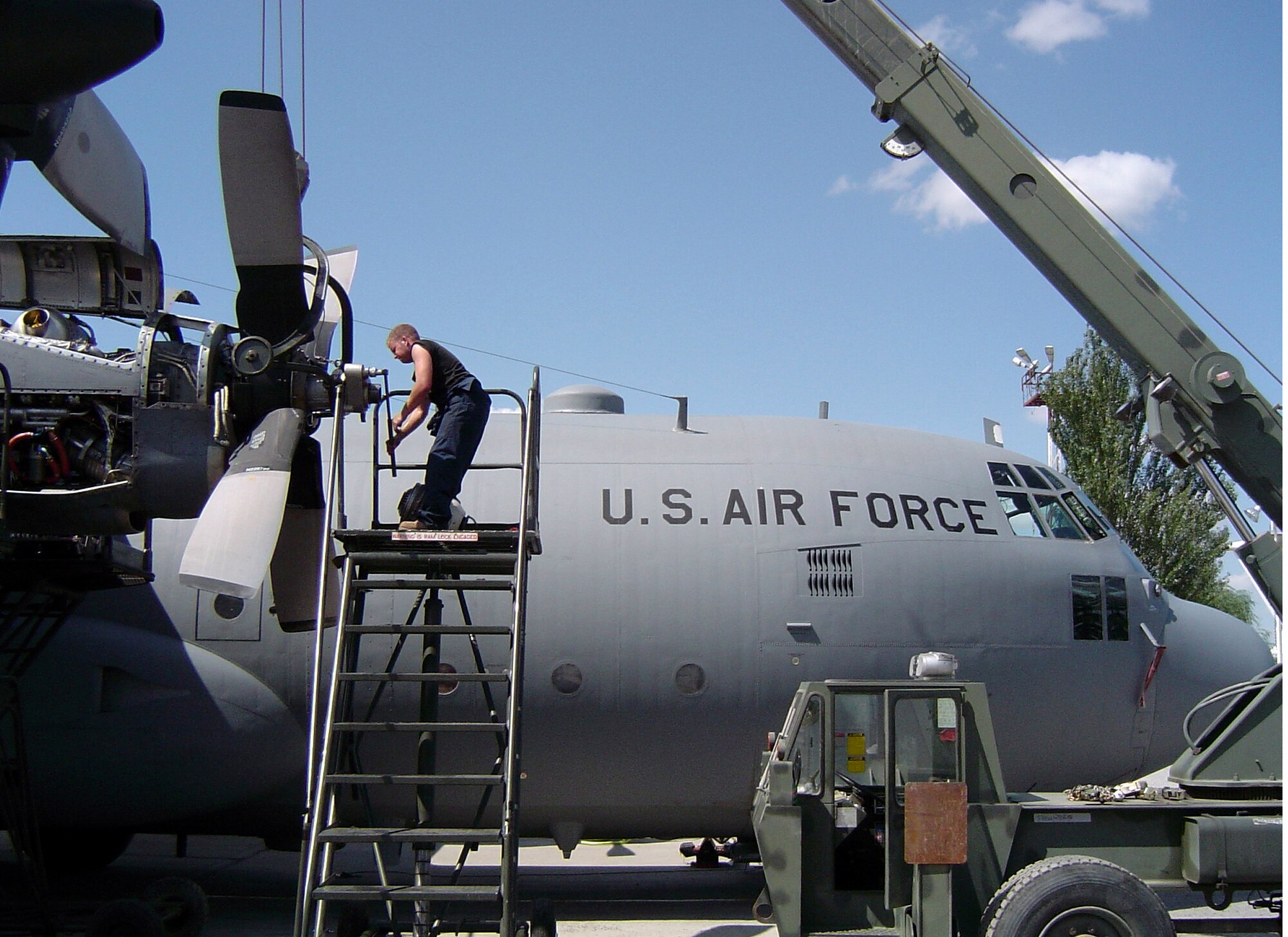 MANAS AIR BASE, Kyrgyz Republic (AFPN) -- Staff Sgt. Ross Steffenauer installs a propeller during an engine change here.  Airmen and aircraft here from Dyess Air Force Base, Texas, are returning home this week.  Dyess C-130s have been deployed nonstop since September 2001. (U.S. Air Force photo by Senior Airman Mike Fields)