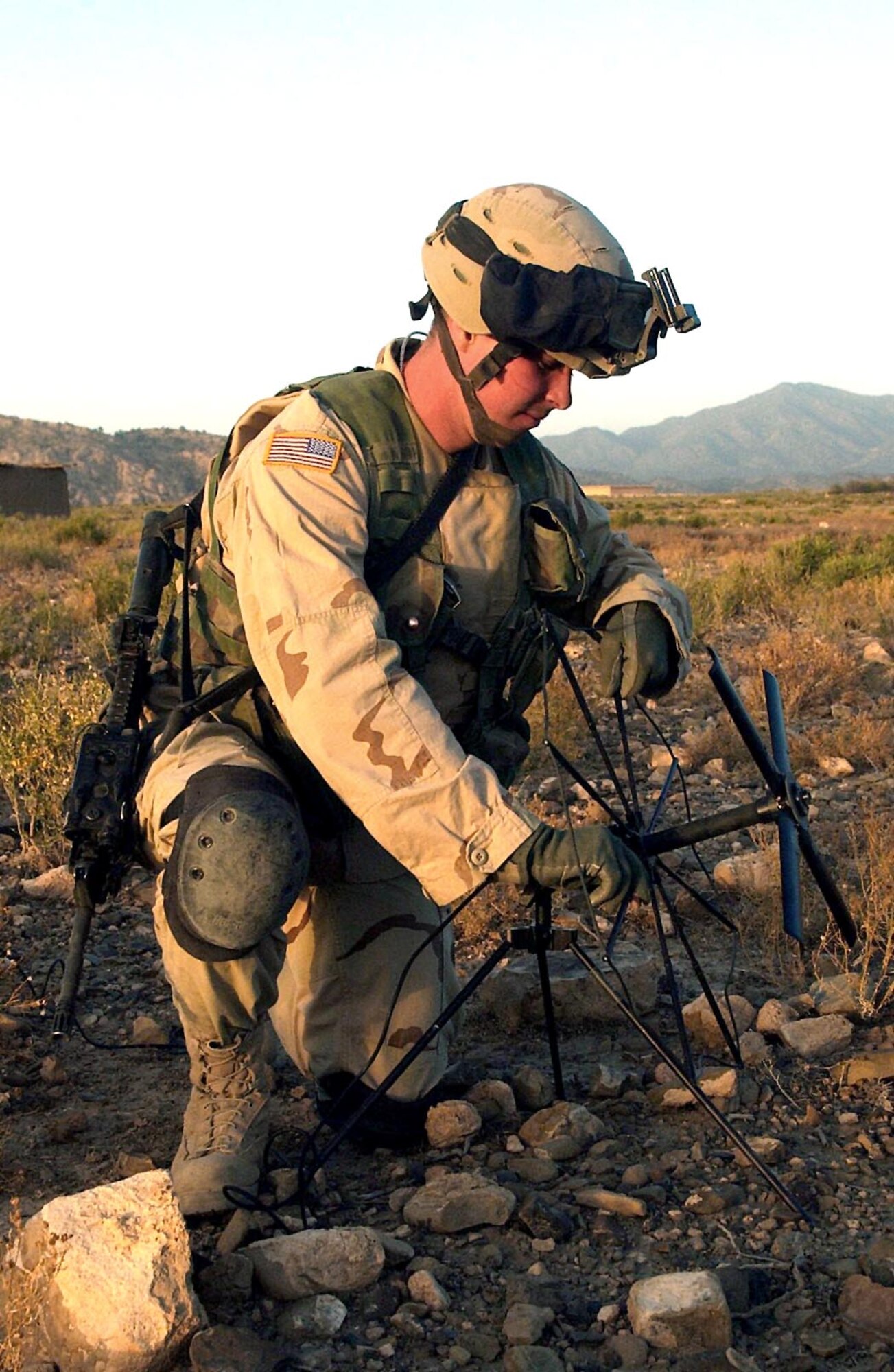 SHKIN FIRE BASE, Afghanistan -- Airman 1st Class Justin Pilant sets up an antenna near here.  Pilant will use the antenna to talk to pilots if he makes contact with the enemy.  Pilant is deployed from the 20th Air Support Operations Squadron at Fort Drum, N.Y.  (U.S. Air Force photo by Staff Sgt. Russell Wicke)