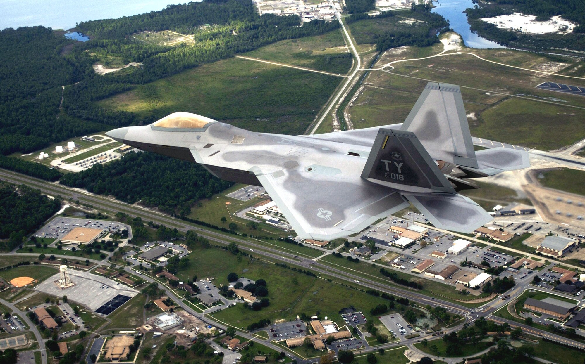 TYNDALL AIR FORCE BASE, Fla. -- The first operational F/A-22 Raptor flies over the base on its delivery flight.  Tyndall is home of the world's first F/A-22 squadron.  (U.S. Air Force photo by Tech. Sgt. Mike Ammons)