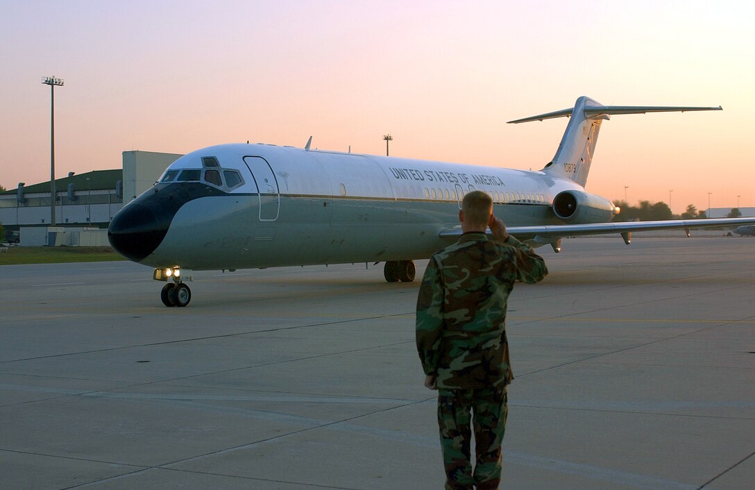 RAMSTEIN AIR BASE, Germany -- Airman 1st Class Gentry Koepp salutes the last C-9 Nightingale aeromedical evacuation from here Sept. 27.  Koepp is a crew chief assigned to the 86th Aircraft Maintenance Squadron.  The 75th Airlift Squadron crew flew the C-9A to Scott Air Force Base, Ill., where it will be transferred to the Air Force Reserve.  (U.S. Air Force photo by Master Sgt. Jon Hanson)