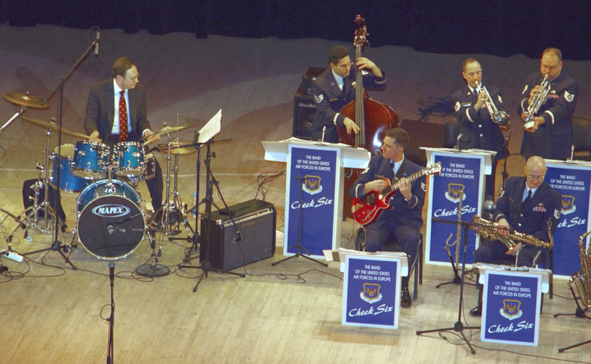 YEKATERINBURG, Russia -- The U.S. ambassador to the Russian Federation, Alexander Vershbow (left), was a guest drummer with a U.S. Air Forces in Europe band as they played here March 31.  The band was here to celebrate the consulate's 10-year anniversary.  (U.S. Air Force photo by Staff Sgt. Marie Cassetty)