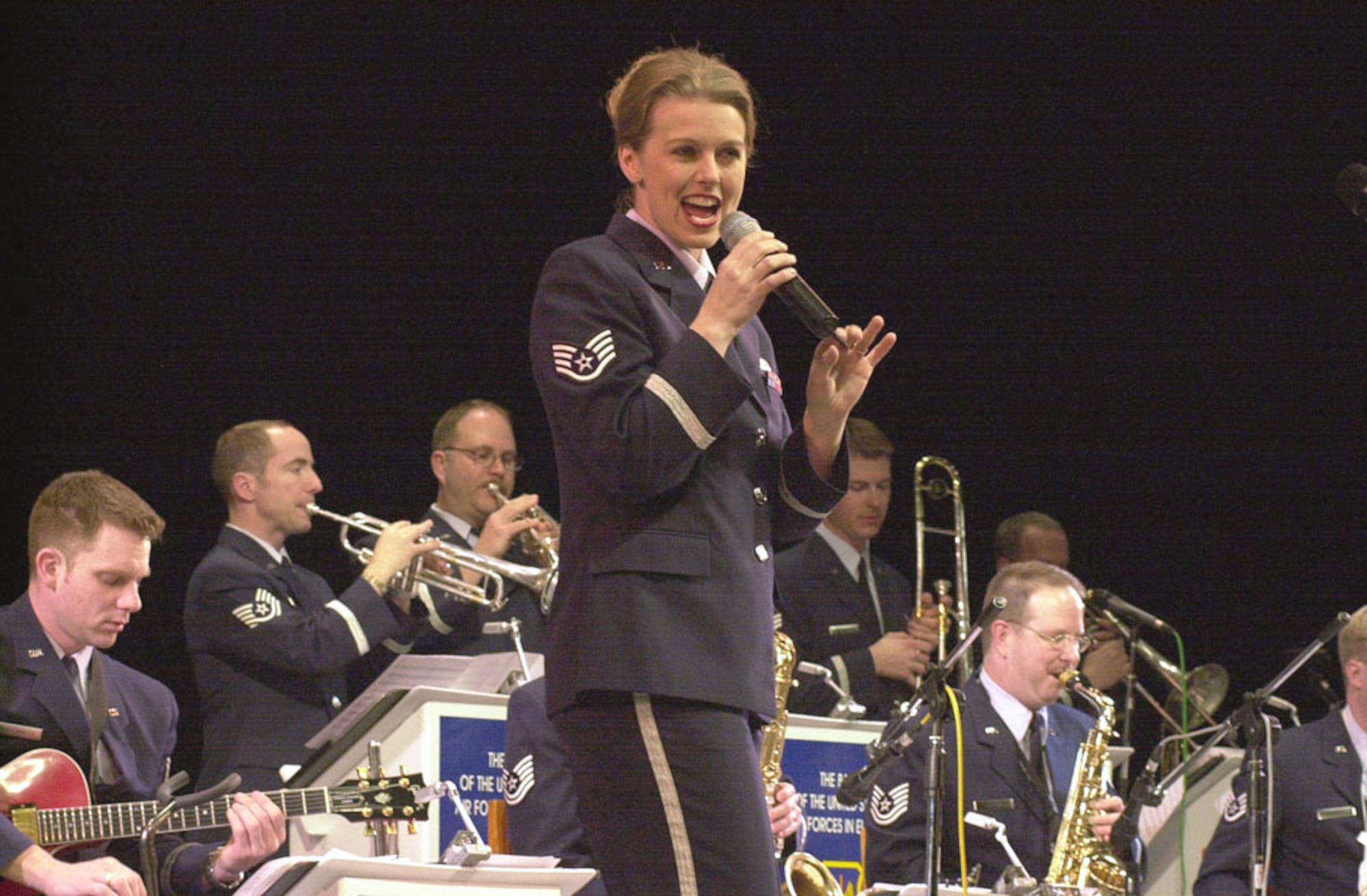 YEKATERINBURG, Russia -- Staff Sgt. Krista Joyce sings with a U.S. Air Forces in Europe band during the 10-year anniversary celebration of the U.S. Consulate General here March 31.  (U.S. Air Force photo by Staff Sgt. Marie Cassetty)