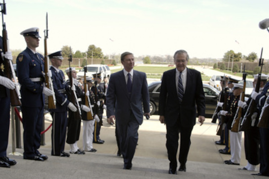 Russian Minister of Defense Sergey Borisovich Ivanov is escorted through an honor cordon and into the Pentagon by Secretary of Defense Donald H. Rumsfeld. The two leaders will meet to discuss defense issues of mutual interest. 