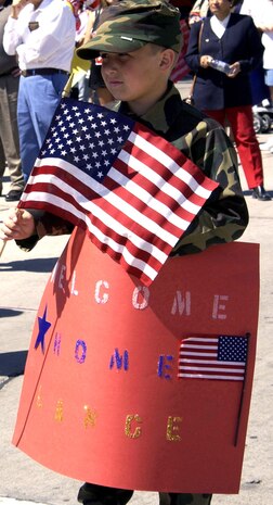NELLIS AIR FORCE BASE, Nev. -- Aaron Merrill anxiously waits to see his step father who is returning home from a 13-month deployment here March 25.  Aaron's step father is a reservist with the U.S. Army's 257th Transportation Company in Las Vegas. (U.S. Air Force photo by Airman 1st Class Daniel DeCook)                 