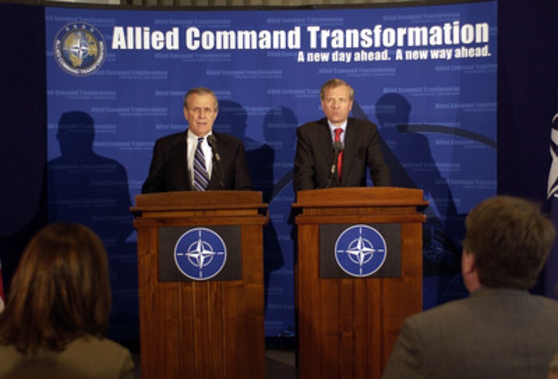 Secretary of Defense Donald H. Rumsfeld (left) and NATO Secretary General Jaap de Hoop Scheffer conduct a joint press conference after meeting with NATO chiefs in Norfolk, Va., on April 6, 2004. Rumsfeld was in Norfolk to address the participants of the Allied Command Transformation Seminar. 