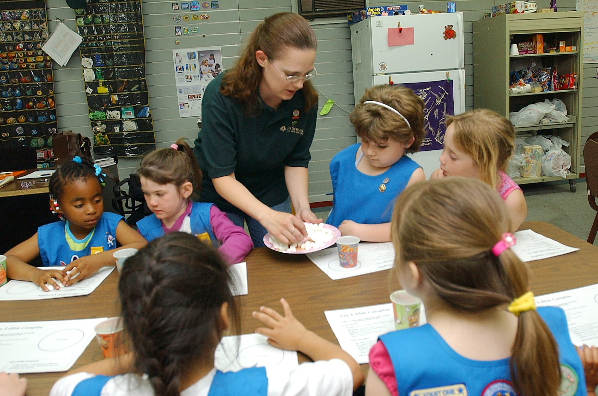 INCIRLIK AIR BASE, Turkey -- Tech. Sgt. Donna Pena passes out marshmallows to Girl Scouts to build an edible campfire.  She is the 39th Air Base Wing assistant law office manager here and a Girl Scout volunteer.  (U.S. Air Force photo by Senior Airman James Seymore III)                                             