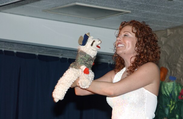 KADENA AIR BASE, Japan -- Mallory Lewis and Lamb Chop perform at Bob Hope Primary School here April 14.  Lamb Chop sported a military uniform and security forces beret to show support to servicemembers.  Ms. Lewis is the daughter of the late Shari Lewis who created the famous sock puppet.  (U.S. Air Force photo by Staff Sgt. C.E. Lewis)