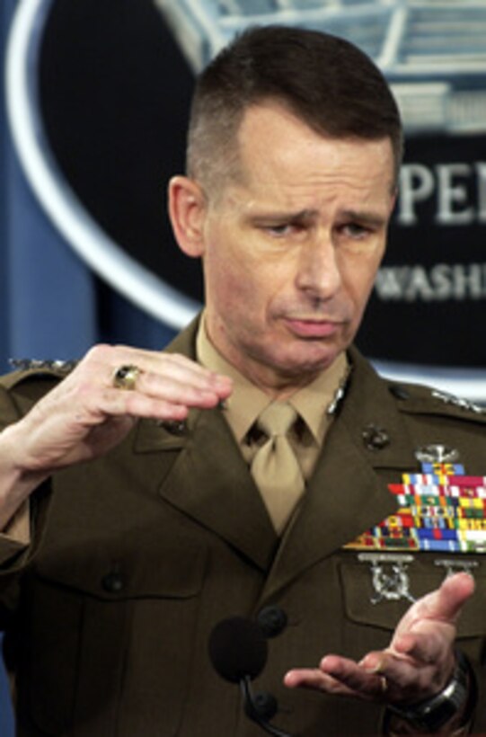 Vice Chairman of the Joint Chiefs of Staff Marine Gen. Peter Pace answers a reporter's question during a Pentagon press briefing with Secretary of Defense Donald H. Rumsfeld on the extension of some deployed units in Iraq on April 15, 2004. 