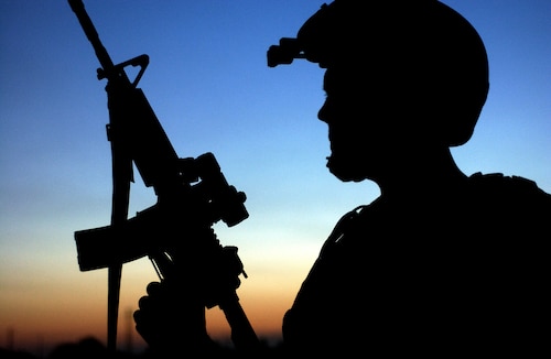 BALAD AIR BASE, Iraq --  A U.S. Air Force tactical air patrol party Airman with the 116th Expeditionary Air Support Operations Squadron scans for threats here April 11. (U.S. Air Force photo by Staff Sgt. Aaron Allmon II)