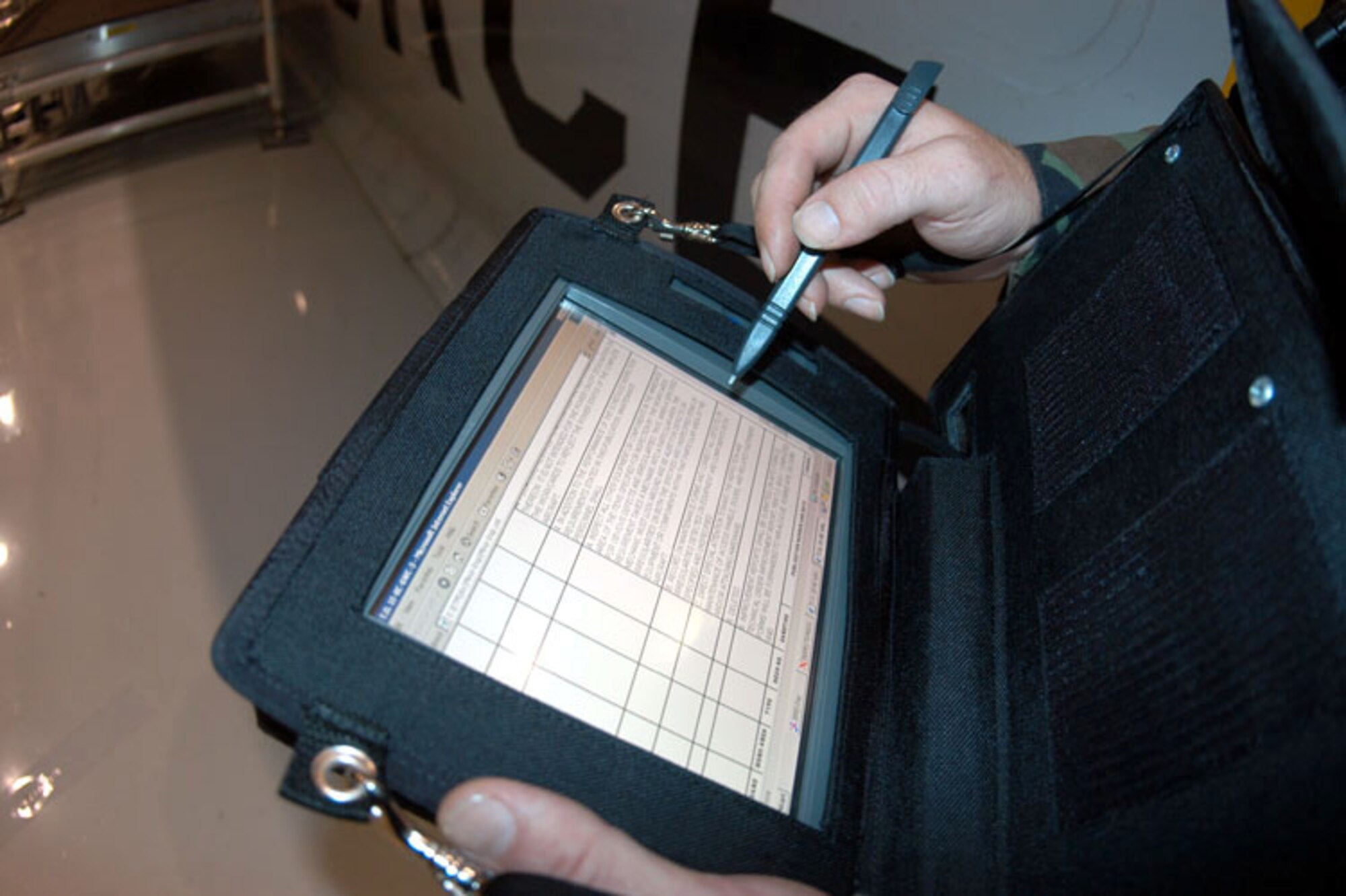 ROBINS AIR FORCE BASE, Ga. -- The new wearable computers allow maintainers to identify, order, ship and pay for parts directly from the flightline.  (U.S. Air Force photo by Senior Airman Tim Beckham)