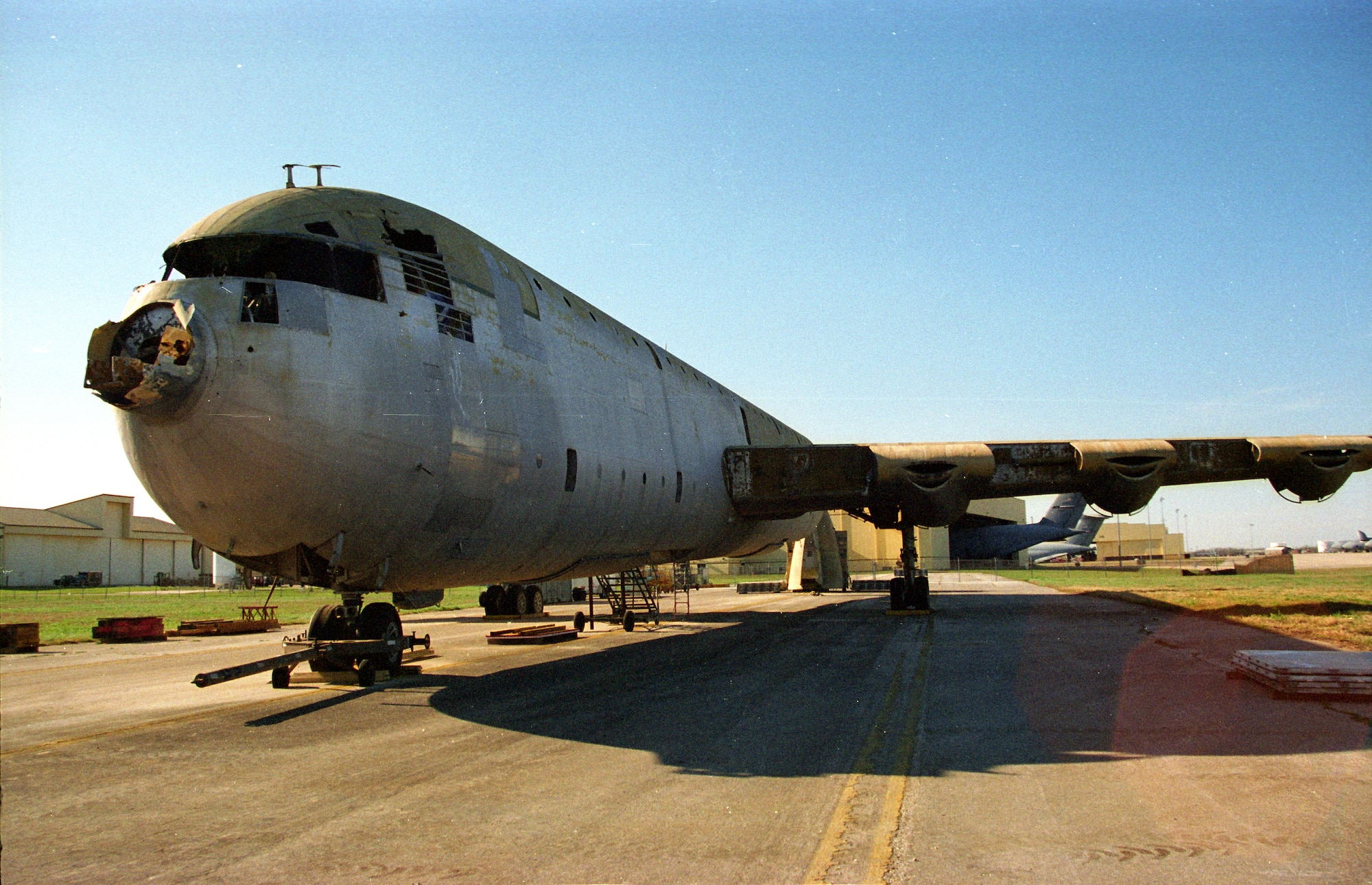 LACKLAND AIR FORCE BASE, Texas -- The XC-99 sits on the ramp at the Kelly Annex to Lackland after Phase 1 of the dismantling process removed engines, doors, access panels, parts of the wings and tail section.  (U.S. Air Force photo by 1st Lt. Bruce R. Hill Jr.)