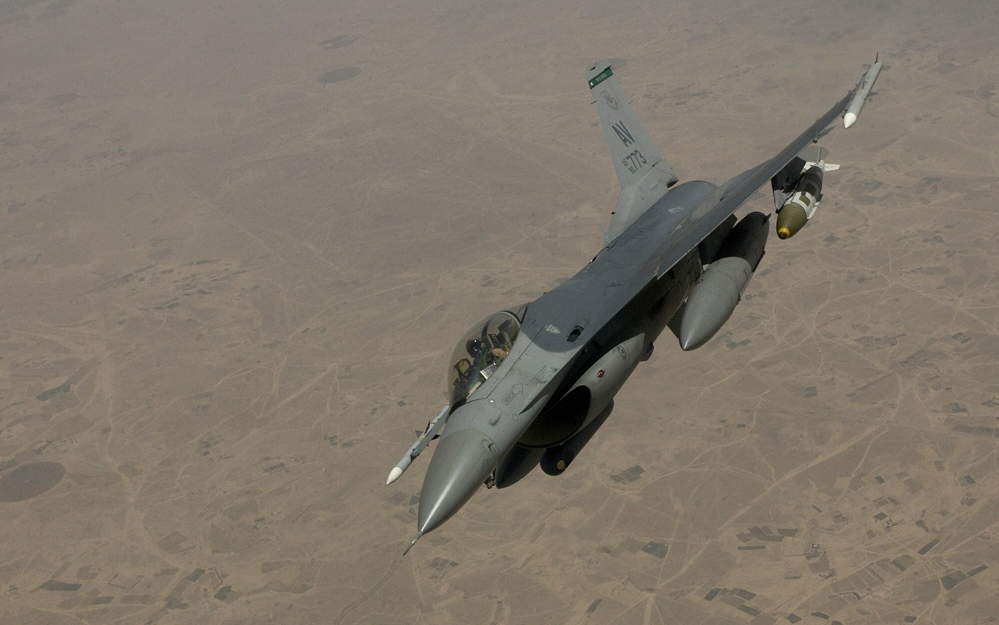 SOUTHWEST ASIA -- An F-16 Fighting Falcon from the 555th Fighter Squadron at Aviano Air Base, Italy, banks away from a KC-135 Stratotanker on April 21 following an aerial refueling.  The F-16 received the 1 billionth pound of fuel distributed from Combined Forces Air Component Command refuelers since Jan. 30, 2003.  (U.S. Air Force photo by Staff Sgt. Aaron Allmon II)