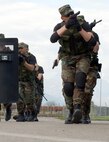 AVIANO AIR BASE, Italy -- Security forces Airmen with the 31st Security Forces Squadron conduct vehicle assault training as part of a joint-tatics training course here April 21.  The week-long course was developed to establish a better working relationship between members of the Office of Special Investigations, the 31st SFS, and the Italian air force carabinieri. (U.S. Air Force photo by Senior Airman Lakisha Croley)