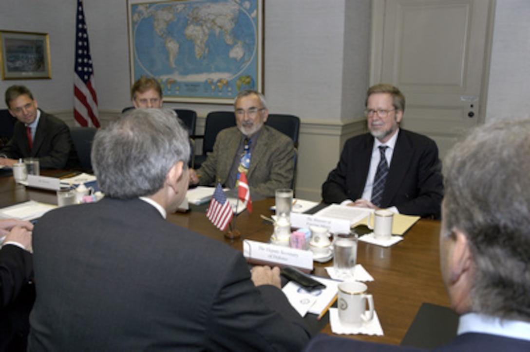 Deputy Secretary of Defense Paul Wolfowitz and his staff meet with Denmark's Minister of Foreign Affairs Per Stig Moeller (right) and Greenland's Deputy Minister of Foreign Affairs Mikaela Engell (center) in the Pentagon on April 26, 2004. Wolfowitz, Moeller and Engell are meeting to discuss defense issues of mutual interest. 