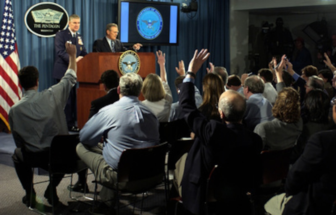 Secretary of Defense Donald H. Rumsfeld calls on a reporter during a Pentagon press briefing with Chairman of the Joint Chiefs of Staff Gen. Richard B. Myers, U.S. Air Force, on April 27, 2004. Rumsfeld and Myers briefed reporters on the situation in Al Fallujah, Iraq. 