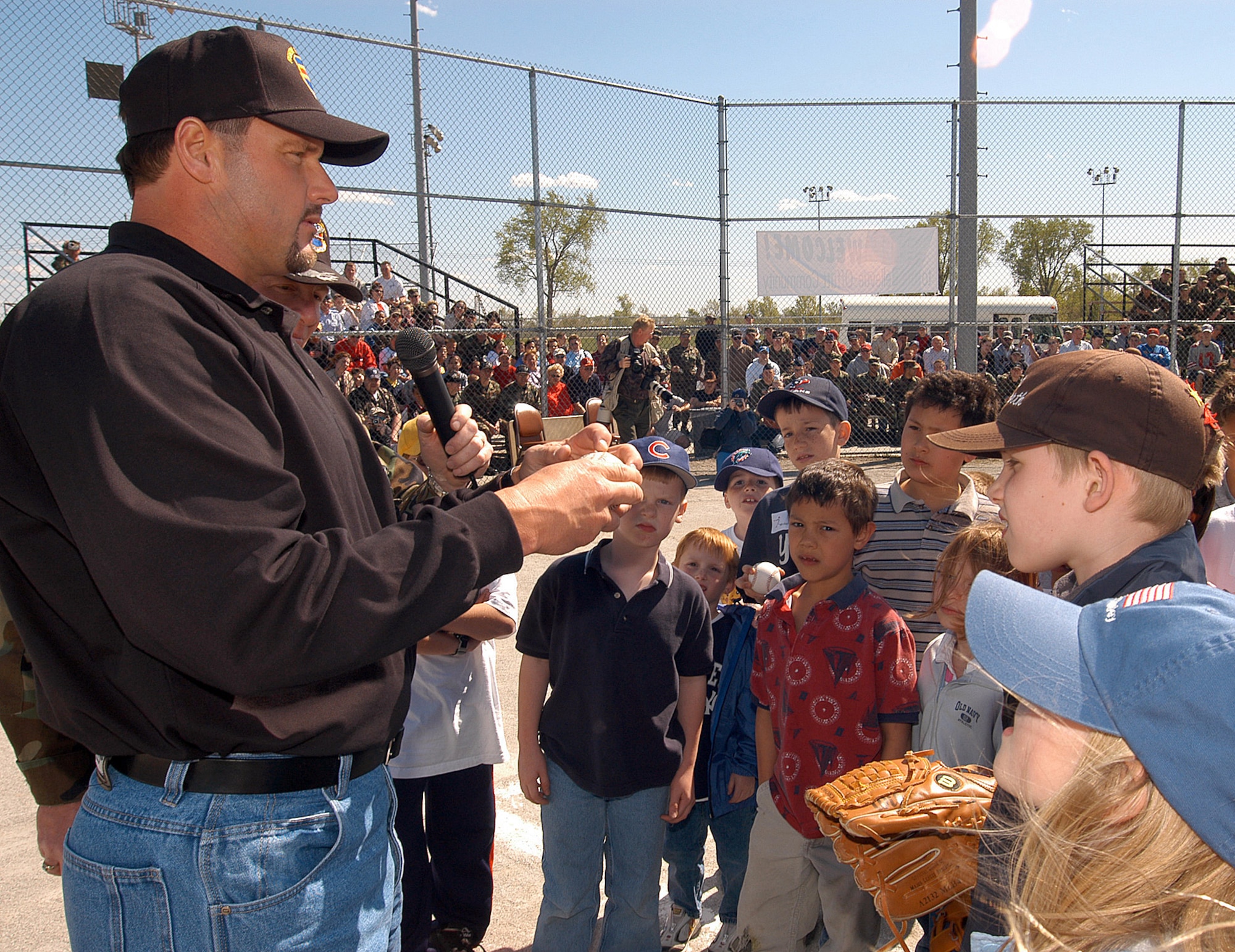 OFFUTT AIR FORCE BASE, Neb. -- Houston Astros pitcher Roger Clemens meets with children here April 26 during a pitching seminar and demonstration.  Mr. Clemens visited as part of a United Service Organizations tour.  (U.S. Air Force photo by Will Hoy)      