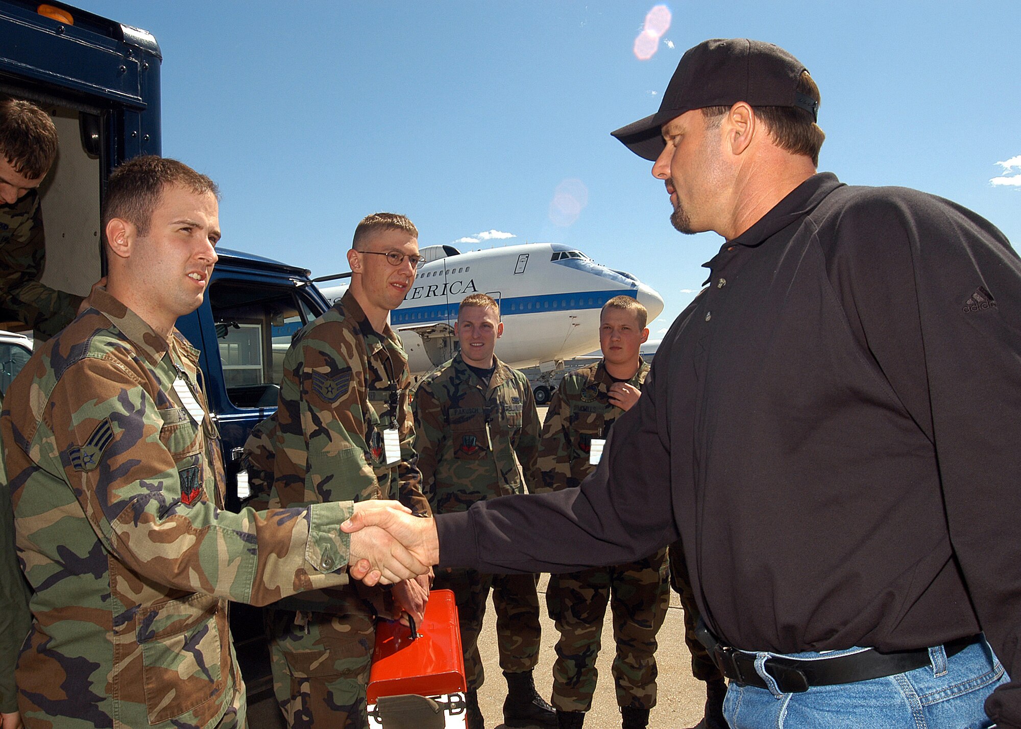 OFFUTT AIR FORCE BASE, Neb. -- Houston Astros pitcher Roger Clemens meets Senior Airman Paul Asp and other Airmen on the flightline here April 26.  Mr. Clemens, known in baseball circles as "The Rocket," visited as part of a United Service Organizations tour.  Airman Asp is an aircraft electronics and environmental systems apprentice.  (Digitally altered U.S. Air Force photo by Will Hoy)                