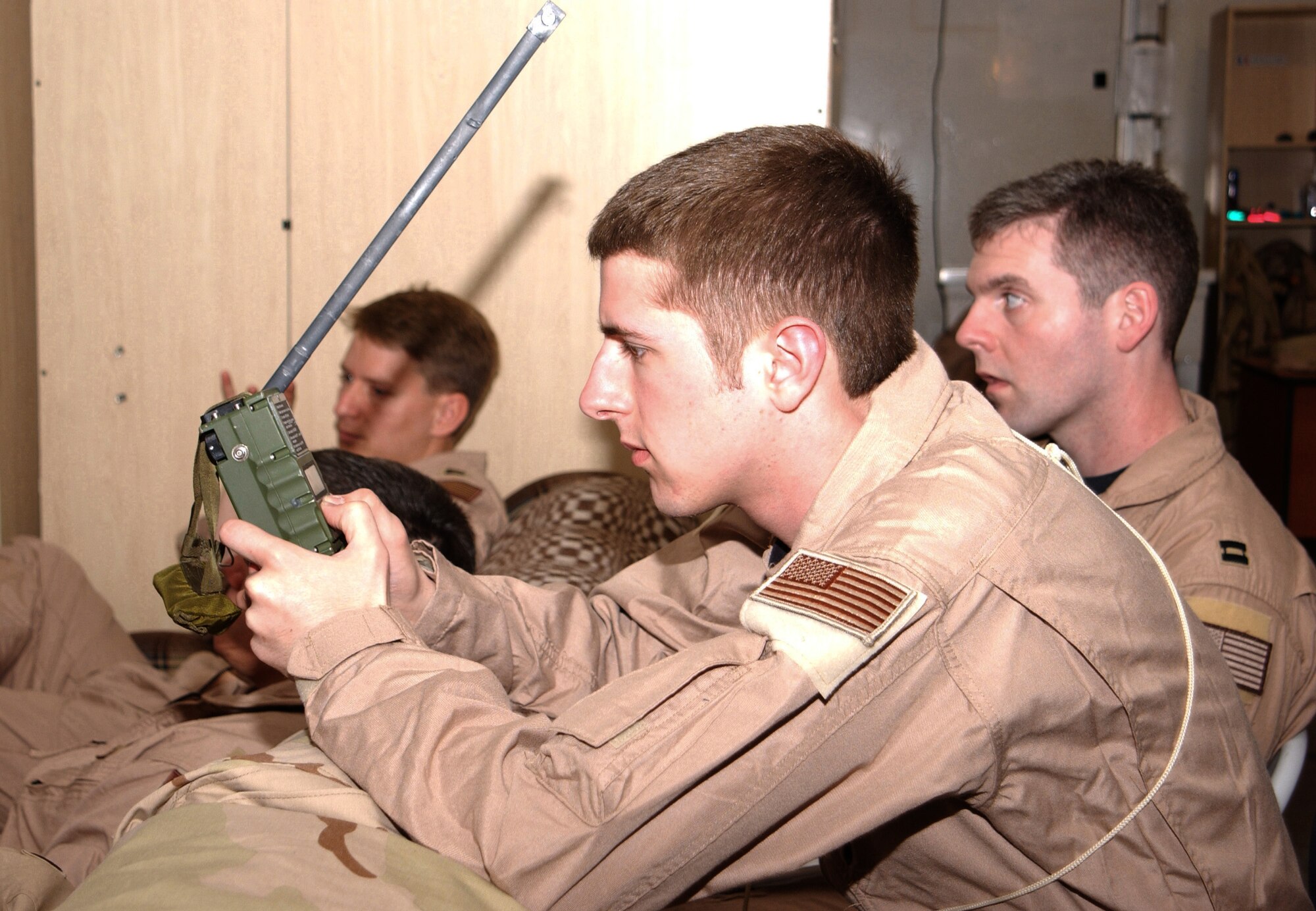 MANAS AIR BASE, Kyrgyzstan -- Airman 1st Class David Thoresen reviews the operation procedures for a survival radio.  Airman Thoreson and his fellow KC-135 Stratotanker aircrew members were attending a class on survival techniques and threats specific to the area.  Airman Thoresen is a boom operator with the 22nd Expeditionary Air Refueling Squadron here.  (U.S. Air Force photo by 1st Lt. Suzanne Ovel)