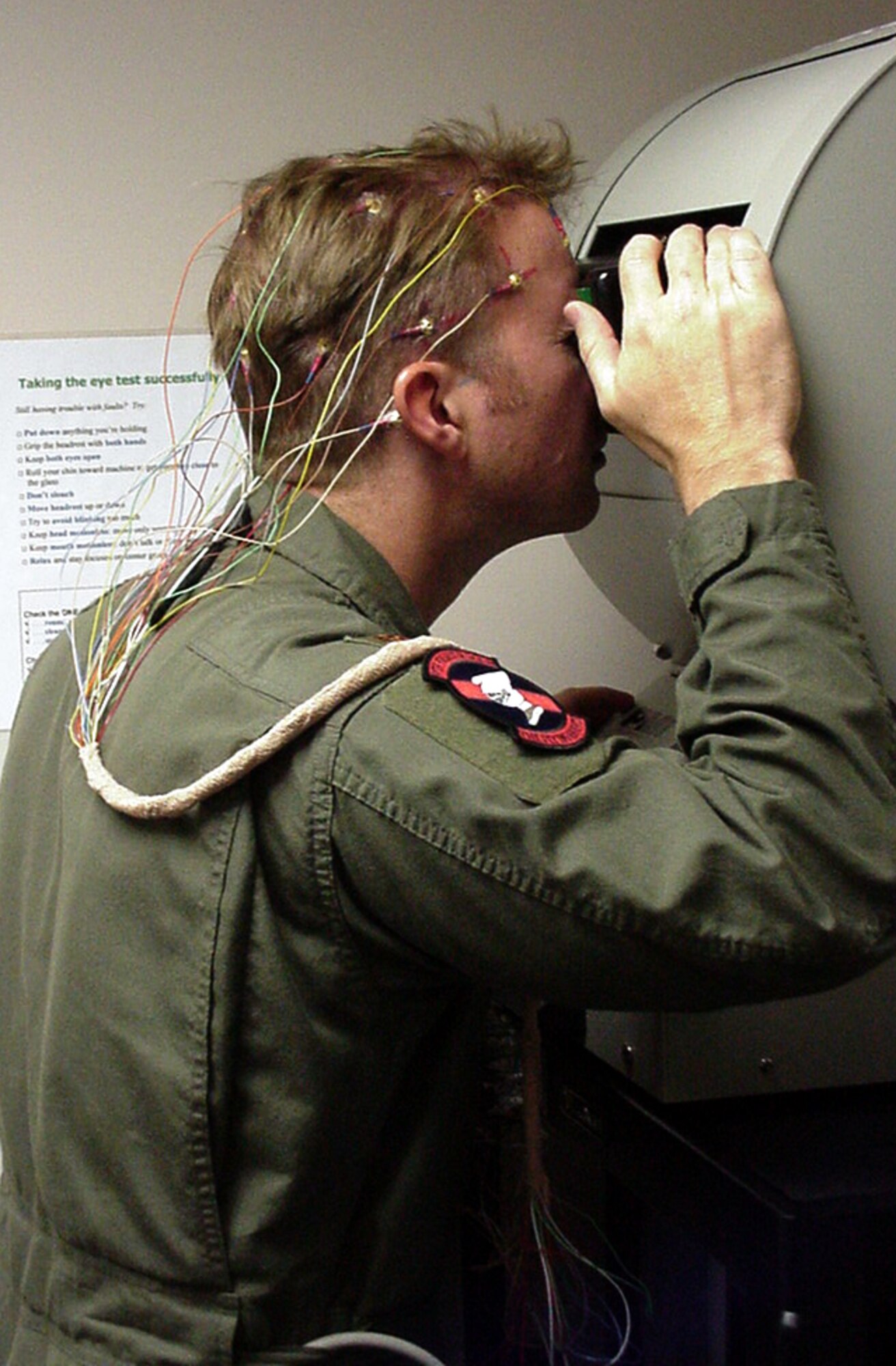 HOLLOMAN AIR FORCE BASE, N.M. -- An F-117A Nighthawk pilot looks into a device that detects changes in pupil size and eye movements during a research study into aviator fatigue.  (Courtesy photo)