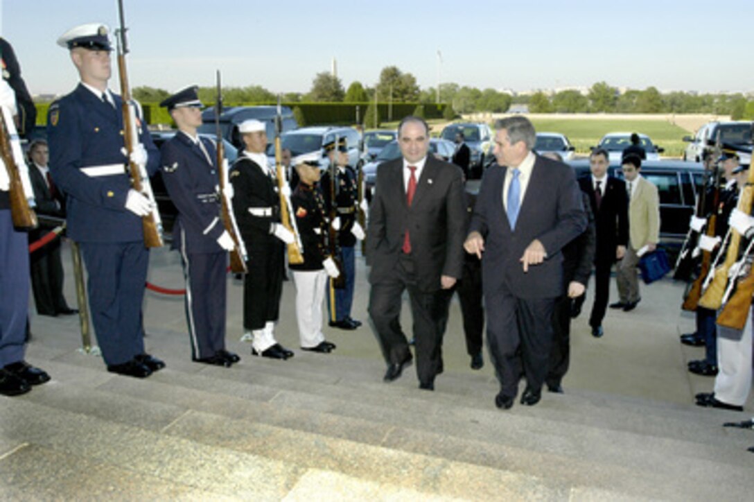 Deputy Secretary of Defense Paul Wolfowitz (right) escorts Georgian Prime Minister Zurab Zhvania through an honor cordon and into the Pentagon on April 28, 2004. Wolfowitz and Zhvania will meet to discuss a range of bilateral security issues. 