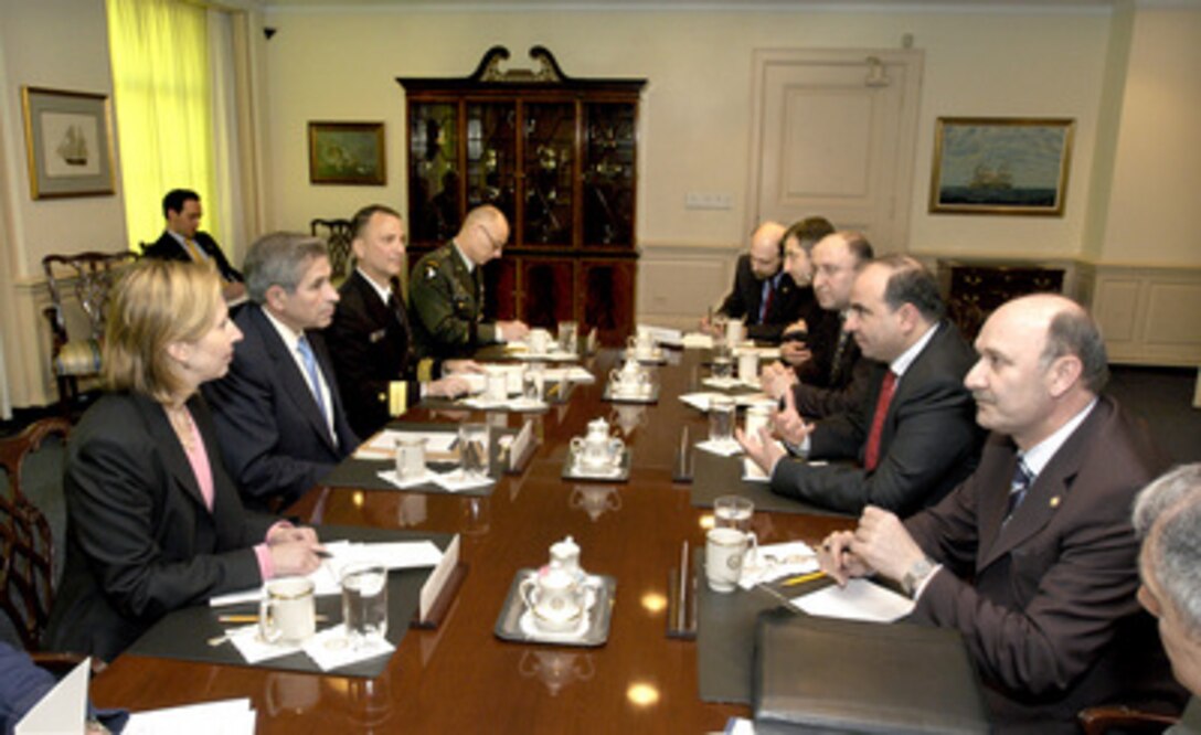 Deputy Secretary of Defense Paul Wolfowitz (second from left) hosts a meeting with a delegation from the Republic of Georgia led by Prime Minister Zurab Zhvania (second from right) and Defense Minister Gela Bezhuashvili (third from right), and the Georgian Ambassador to the United States Levan Mikeladze (right) in the Pentagon on April 28, 2004. Participants on the U.S. side include (left to right): Acting Assistant Secretary of Defense for International Security Policy Mira Ricardel, Wolfowitz, Deputy Director of J-5 Rear Adm. Donald Loren, U.S. Navy, and Senior Military Assistant to the deputy secretary of defense Brig. Gen. Frank Helmick, U.S. Army. A broad range of security issues of mutual interest to both nations is under discussion. 