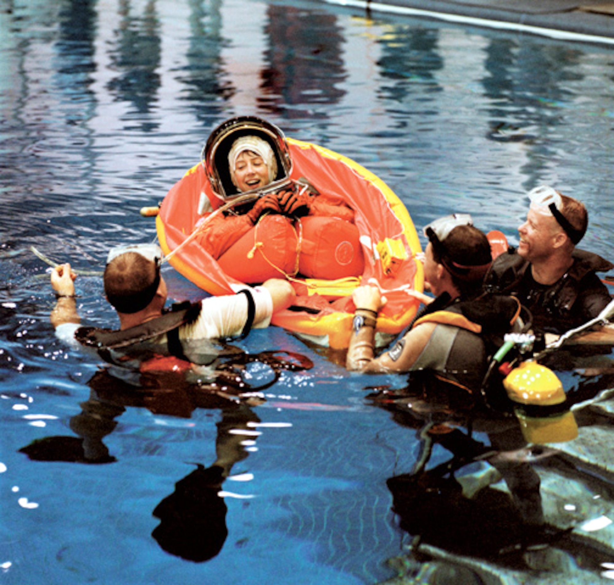 HOUSTON -- Astronaut and pilot Col. Pam Melroy is assisted by three scuba-equipped divers in the deep pool at the Neutral Buoyancy Laboratory at the Sonny Carter Training Facility near the Johnson Space Center.  She and the rest of the STS-92 crew were participating in an emergency bailout training exercise preparing for next year's scheduled visit to the International Space Station.  (Photo courtesy of NASA)