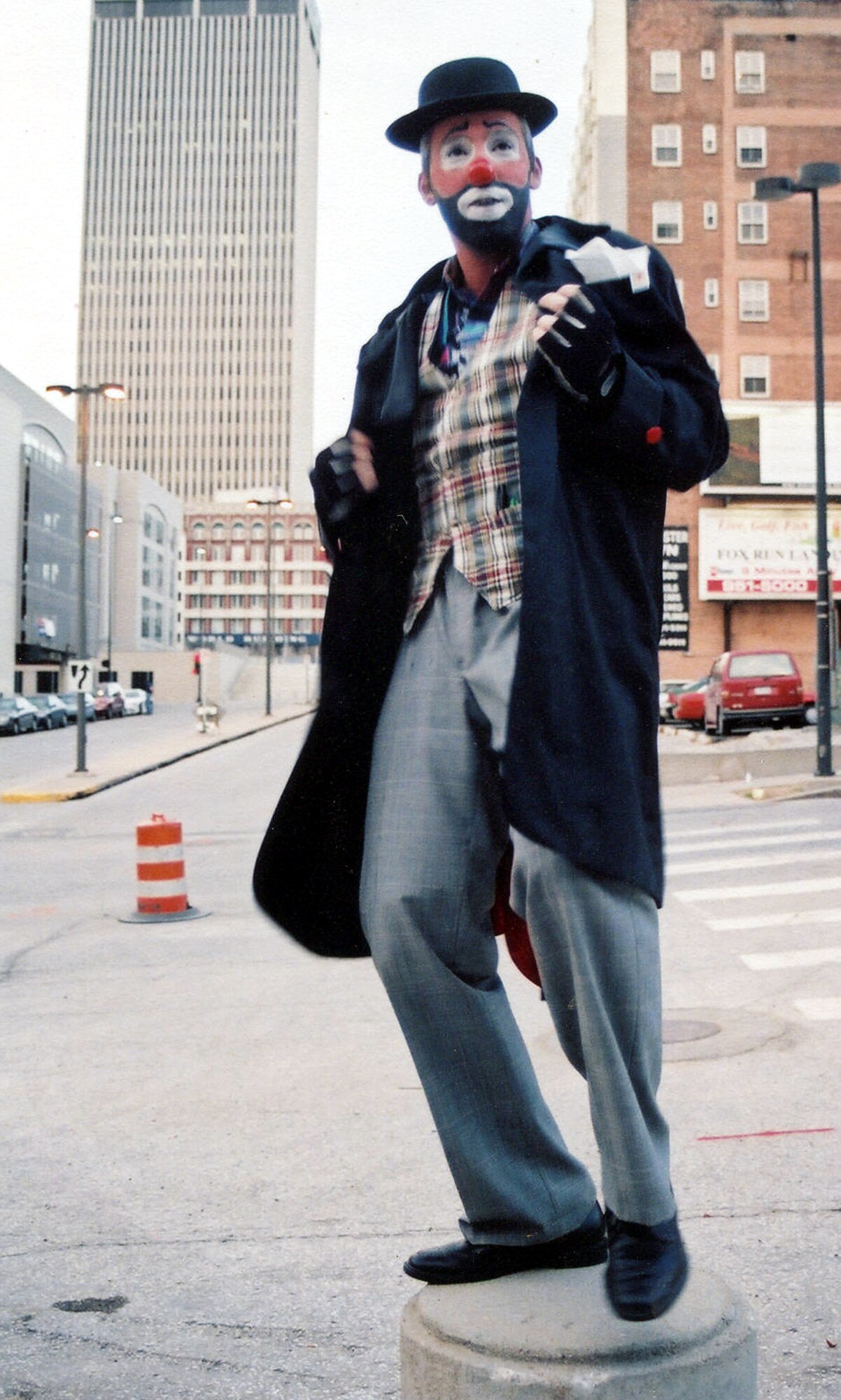 OMAHA, Neb. -- Senior Master Sgt. A.J. Johnson as Kleenax the clown visits downtown before joining his clown buddies for the annual Shrine Circus here.  At work, he is a supervisor in the Joint Intelligence Center of U.S. Strategic Command.  During his off time, he becomes Kleenax or Splinter.  (Courtesy photo)