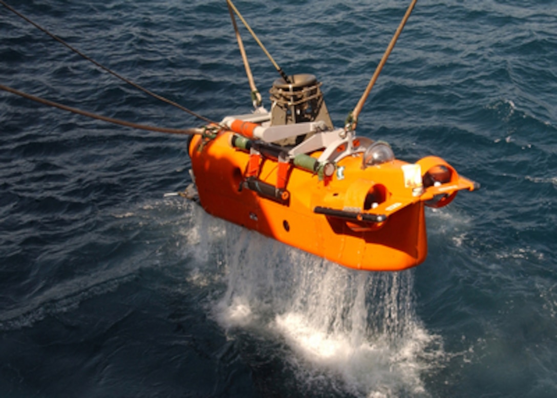 Water streams off a Navy AN/SLQ-48 Mine Neutralization Vehicle as it is raised out of the Persian Gulf on July 28, 2004. The vehicle's system uses a remote-controlled submersible vehicle to identify and render underwater objects as safe. The AN/SLQ-48 is attached to the countermeasure ship USS Dextrous (MCM 13), which is deployed in support of Operation Iraqi Freedom. 