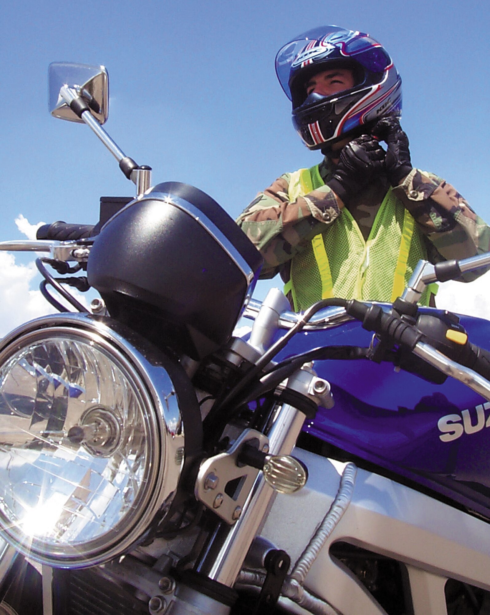 DAVIS-MONTHAN AIR FORCE BASE, Ariz. -- Senior Airman Timothy Thrall suits up in the required safety gear before heading off base for a ride on his motorcycle.  Airman Thrall is assigned to the 355th Component Maintenance Squadron and is one of many motorcycle riders on base.  (U.S. Air Force photo by Staff Sgt. Russell Wicke)
