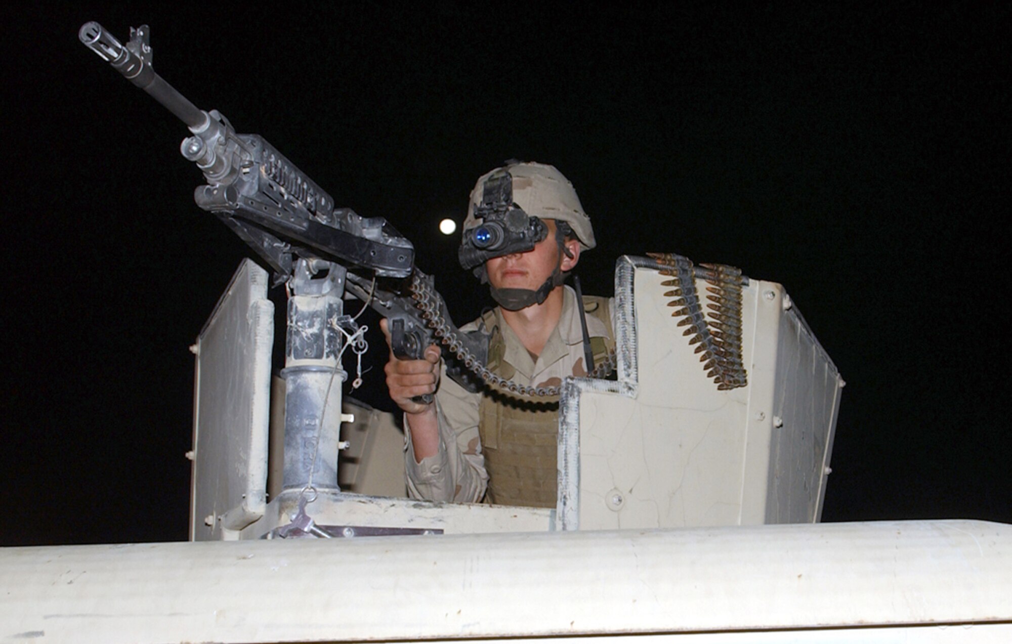 BAGRAM AIR BASE, Afghanistan -- Airman 1st Class Ryan Flory uses night-vision goggles during an early morning patrol along the base perimeter here.  Airman Flory is assigned to the 455th Expeditionary Security Forces Squadron and deployed from McChord Air Force Base, Wash.  (U.S. Air Force photo by Master Sgt. Andrew Gates)