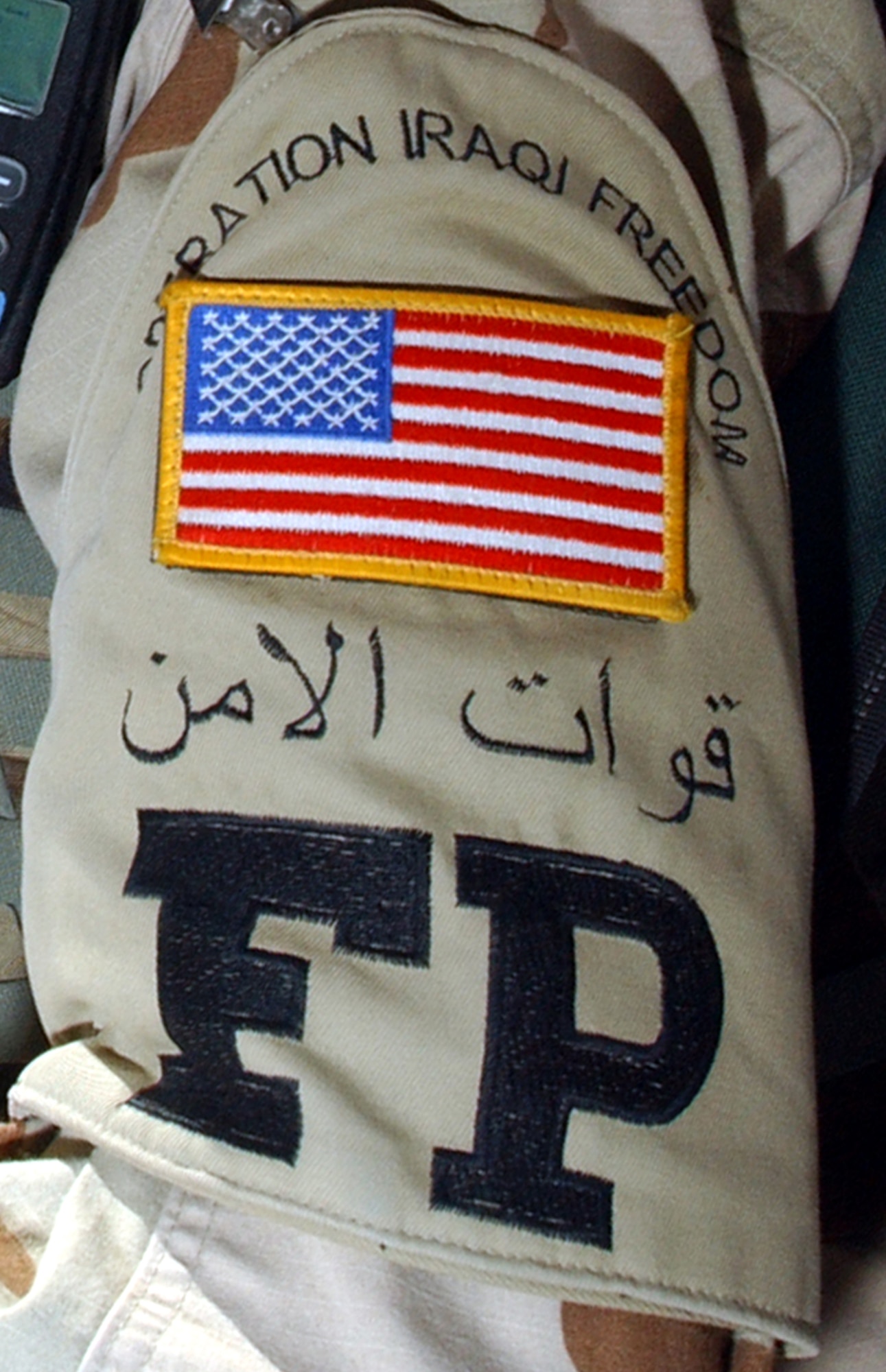 TALLIL AIR BASE, Iraq -- Airmen assigned to the 407th Expeditionary Civil Engineer Squadron's force protection flight here wear distinctive armbands while keeping watch over third-country and local-national workers.  (U.S. Air Force photo by Staff Sgt. Craig Clapper)