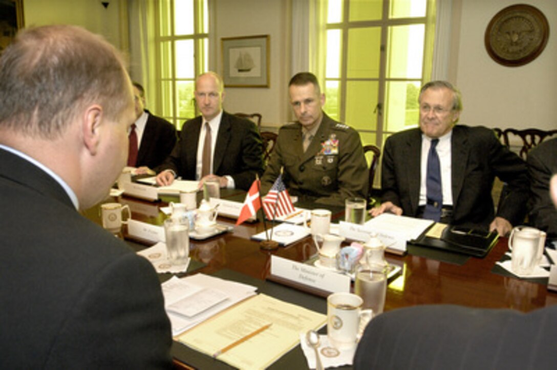 Secretary of Defense Donald H. Rumsfeld (right) hosts a Pentagon meeting with Danish Minister of Defense Soren Gade (foreground) on Aug. 9, 2004. Joining Rumsfeld are several senior Department of Defense officials including (left to right): Director for European Policy (North) Jesse Kelso, Deputy Assistant Secretary of Defense for European and NATO Policy Ian Brzezinski, and Vice Chairman of the Joint Chiefs of Staff Gen. Peter Pace, U.S. Marine Corps. 