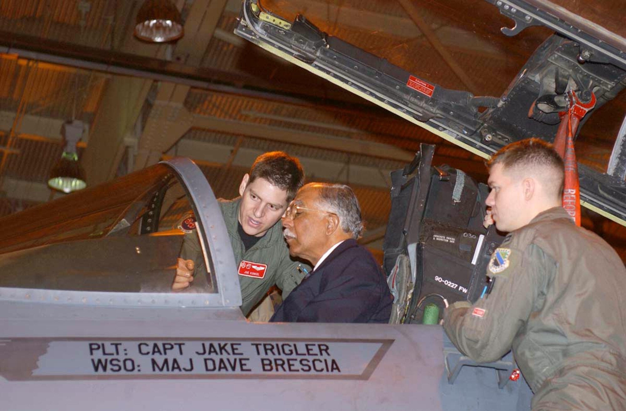 ELMENDORF AIR FORCE BASE, Alaska (AFPN) -- Capt. Joe Kunkel (left) explains F-15E Strike Eagle instrument gauges to retired Lt. Gen. William E. Brown Jr., while Capt. Ahren Heidt looks on. Both captains are assigned to the 90th Fighter Squadron at Elmendorf Air Force Base, Alaska. Brown toured the squadron before giving the keynote speech at the base's Black History Month kick-off luncheon.  (U.S. Air Force photo by Staff Sgt. Prentice Colter)