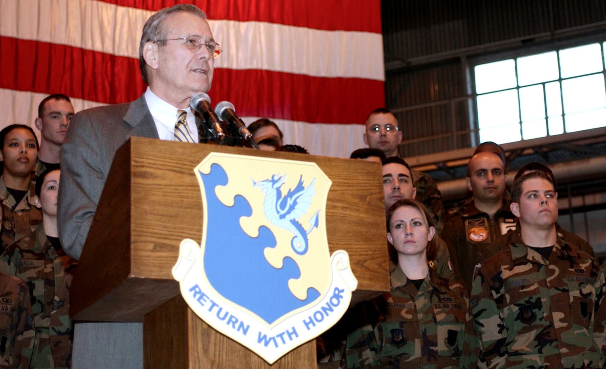 AVIANO AIR BASE, Italy (AFPN) -- Secretary of Defense Donald Rumsfeld speaks with servicemembers during a town hall meeting Feb. 7 at Aviano Air Base, Italy. Rumsfeld visited the Air Force's only fighter wing south of the Alps for a few hours as part of a trip to gain European support for the global war on terrorism and future contingencies. (U.S. Air Forec photo by Staff Sgt. Staci L. Rosenberger)