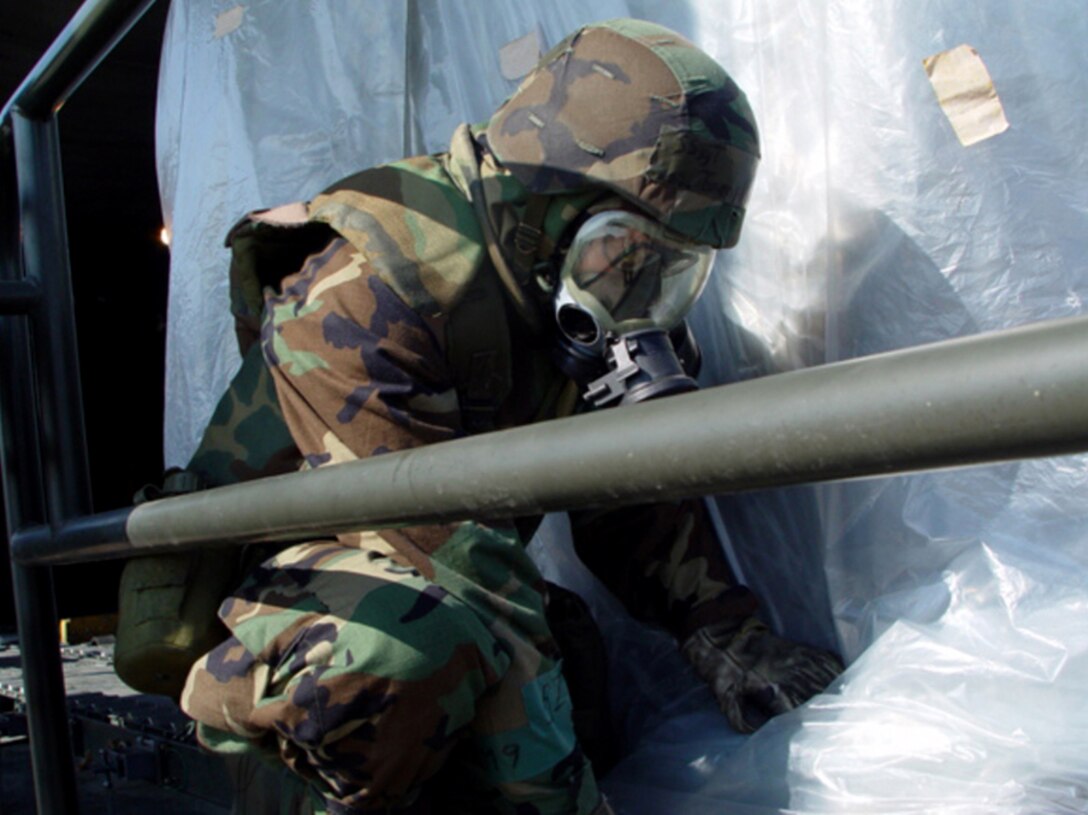 OSAN AIR BASE, South Korea (AFPN) -- Staff Sgt. James Tompkins secures a pallet of possibly contaminated cargo during an Air Mobility Command offload/exchange zone concept operations exercise here. Tompkins is assigned to the base's 731st Air Mobility Squadron. (U.S. Air Force photo by 1st Lt. Toni Tones)