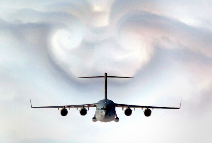 A C-17 Globemaster III parts the clouds over western South Carolina during a training mission Feb. 2. The aircraft is assigned to the state's Charleston Air Force Base. (U.S. Air Force photo/Staff Sgt. D. Myles Cullen)