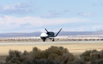 EDWARDS AIR FORCE BASE, Calif. -- The seventh Global Hawk unmanned aerial vehicle lands here after its flight from Air Force Plant 42 in nearby Palmdale, Calif., The UAV was built by lead government contractor Northrop Grumman.  (U.S. Air Force photo by Mike Charlie)