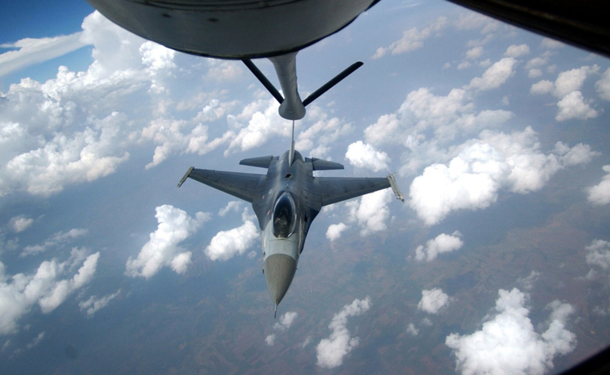 KORAT AIR BASE, Thailand (AFPN) -- An F-16 Fighting Falcon prepares for refueling by a KC-135 Stratotanker from the 909th Air Refueling Squadron at Kadena Air Base, Japan, during Cope Tiger 2003. Cope Tiger is an annual joint/combined air-to-air, air-to-ground and large force employment training exercise. (U.S. Air Force photo by Staff Sgt. Cecilio M. Ricardo Jr.)