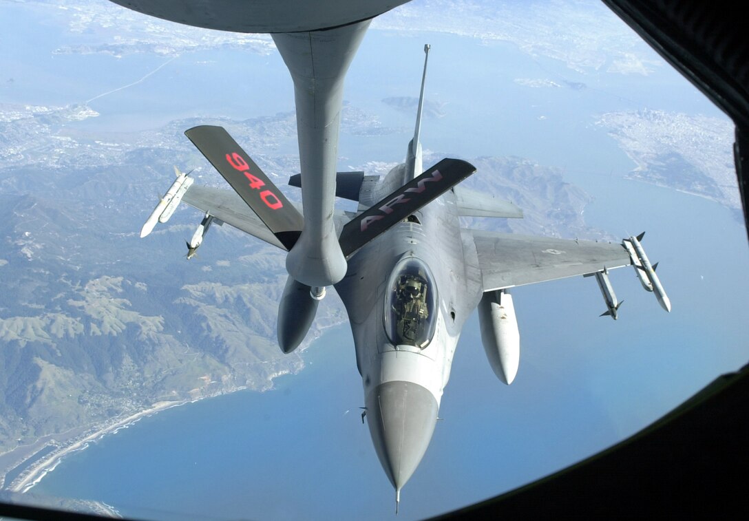 OPERATION NOBLE EAGLE -- An F-16 Fighting Falcon from the California Air National Guard prepares to receive fuel from an Air Force Reserve Command KC-135E Stratotanker during an Operation Noble Eagle combat air patrol over San Francisco's Golden Gate. The KC-135E and its crew are assigned the 940th Air Refueling Wing at Beale Air Force Base, Calif. The F-16 and its pilot are from the 144th Fighter Wing at Fresno Air National Guard Base, Calif.  (U.S. Air Force photo by Maj. Robert Couse-Baker)