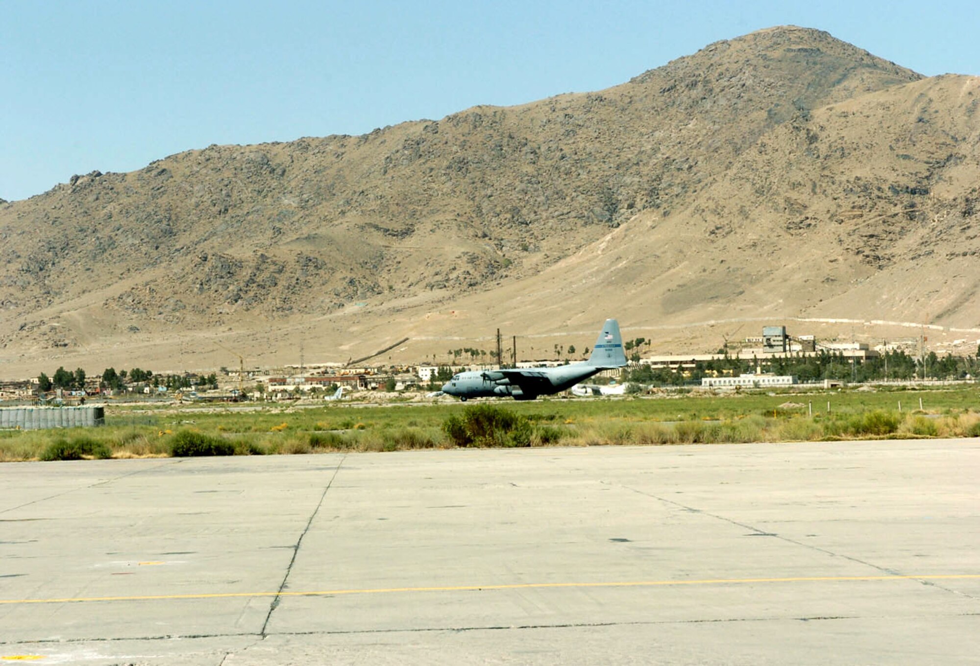 KABUL, Afghanistan -- A U.S. Air Force C-130 Hercules is about to take off from Kabul International Airport here Aug. 15 on its way to Shindand National Airport carrying Afghan soldiers.  They are deploying to Shindand to retake control of government property seized as a result of factional fighting in the area.  (U.S. Air Force photo by Master Sgt. Ann Bennett)