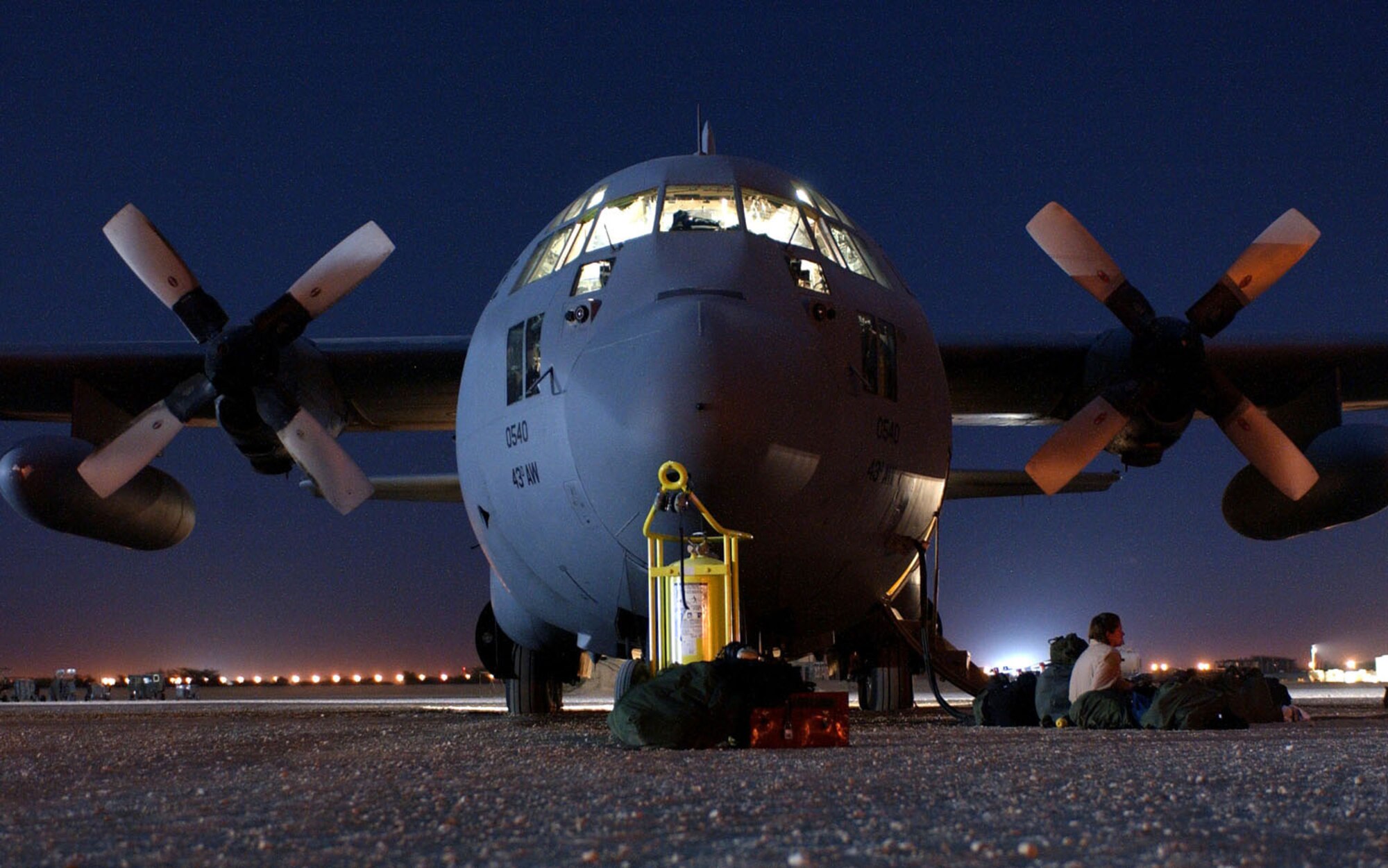 OPERATION ENDURING FREEDOM -- A C-130 Hercules, assigned to the 320th Air Expeditionary Wing at a forward-deployed location, awaits its next mission on the flightline.  The aircraft was used to perform a heavy equipment airdrop into south central Afghanistan supporting Operation Enduring Freedom.  (U.S. Air Force photo by Staff Sgt. Cherie Thurlby)