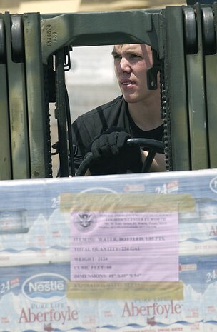 DOBBINS AIR RESERVE BASE, Ga. -- An Airman from the 437th Airlift Squadron at Charleston Air Force Base, S.C., uses a forklift to move relief supplies on pallets here Aug. 14.  The Airmen are supporting Hurricane Charley relief operations being conducted by the Federal Emergency Management Agency in Florida.  (U.S. Air Force photo by Staff Sgt. Aaron D. Allmon II)