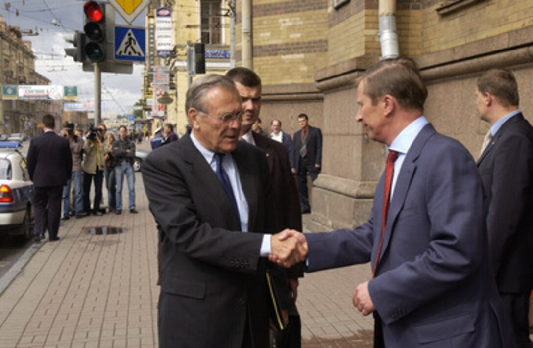 Secretary of Defense Donald H. Rumsfeld (left) shakes hands with Russian Minister of Defense Sergey Ivanov after their meetings and a joint press conference in the House of Officers in St. Petersburg, Russia, on Aug. 14, 2004. Rumsfeld and Ivanov met to discuss U.S.-Russian defense, security relations and regional security issues and spoke to reporters at the conclusion of their meetings. 