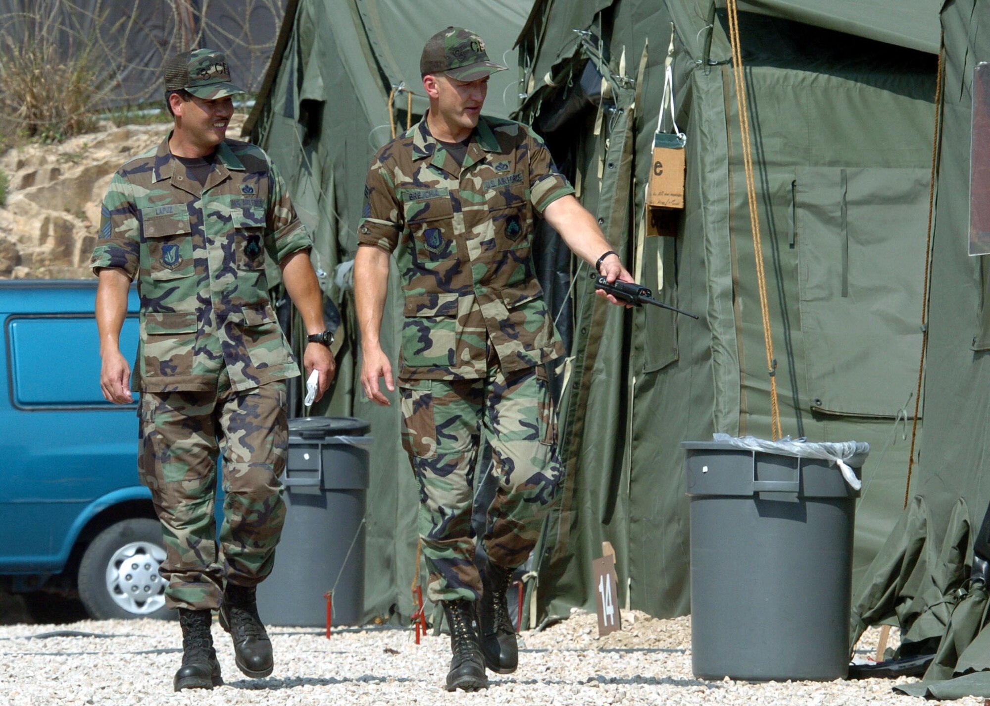 KUNSAN AIR BASE, South Korea -- Senior Master Sgt. Manny Lapuz (left) and Chief Master Sgt. Mark Brejcha inspect tent city here.  They are assigned to the 8th Civil Engineer Squadron.  Civil engineers are providing a home for about 300 Airmen who are deployed here from the 49th Fighter Wing at Holloman Air Force Base, N.M.  (U.S. Air Force photo by Master Sgt. Val Gempis)
