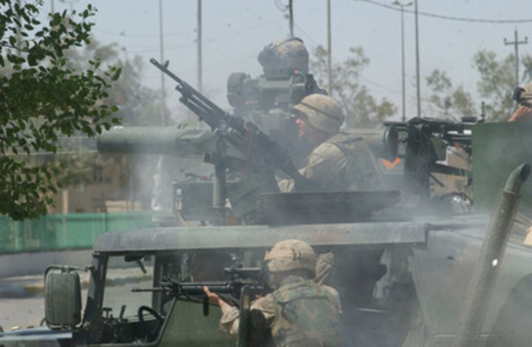 U.S. Marines from the 11th Marine Expeditionary Unit fight against Medhi Army militia members in the holy Shiite city of Najaf, Iraq, on Aug. 5, 2004. 